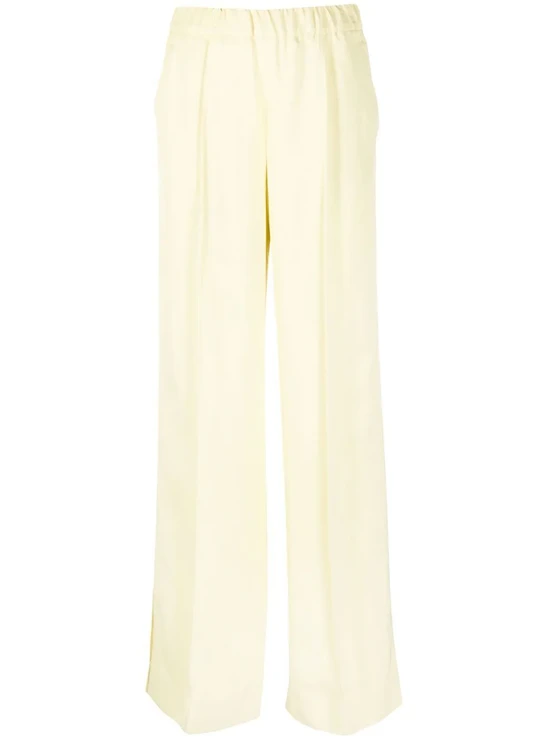 Žluté kalhoty s vysokým pasem, JIL SANDER, prodává Farfetch, 415 €